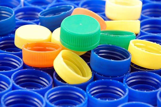 istock Rows of blue and colorful plastic lids - caps 104793189