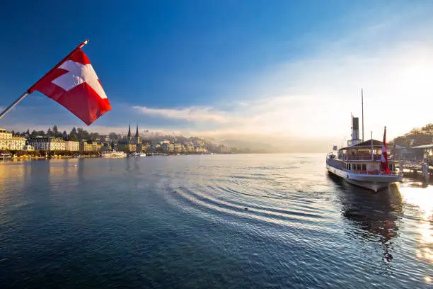 Photo of Lucern lake and town waterfront in morning mystic fog view, famous destination in Switzerland