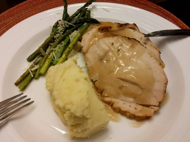 istock Delicious and healthy turkey with asparagus and mashed potatoes 1047950792