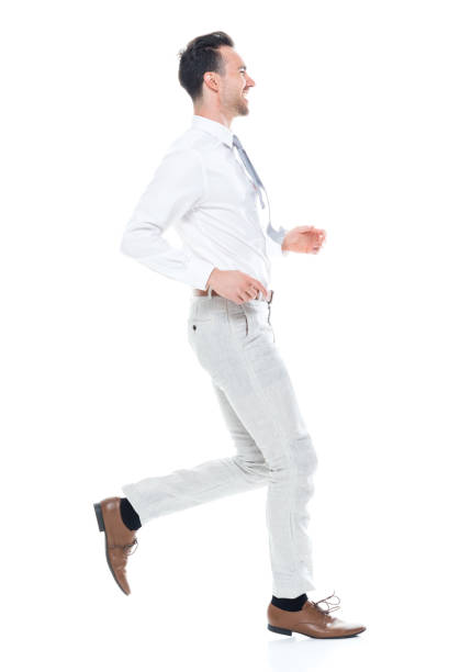 istock Handsome businessman running, side view 1047951300