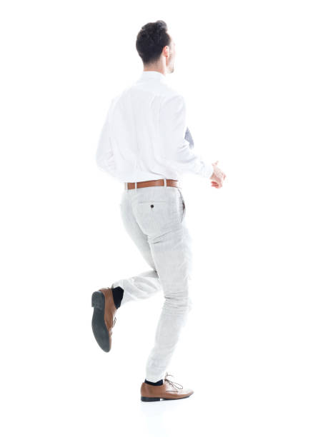 istock Handsome businessman running, rear view 1047951324