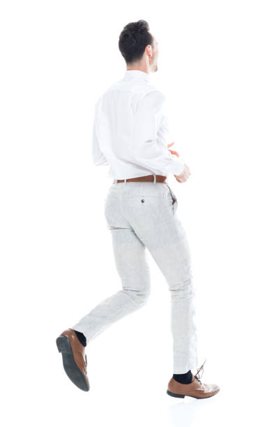 istock Handsome businessman running, rear view 1047951326