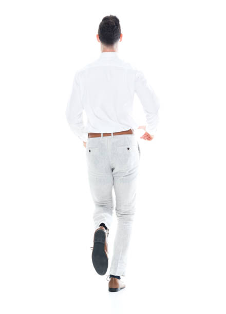istock Handsome businessman running, rear view 1047951348