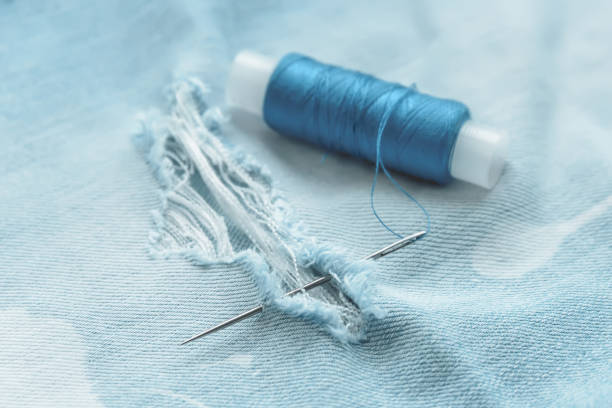 istock composition of seamstress, tailor, thread for sewing and for knitting 1047956758