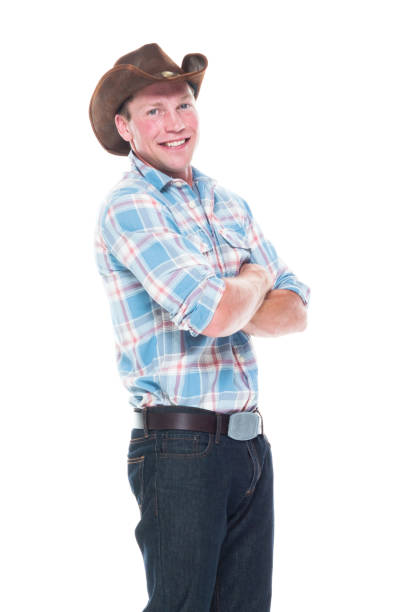 istock Handsome cowboy is standing with arms folded 1047961196