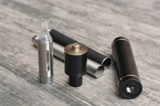 istock E - cigarette for vaping , technical devices.The liquid in the bottle 1047961696