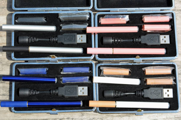 istock E - cigarette for vaping , technical devices.The liquid in the bottle 1047961778
