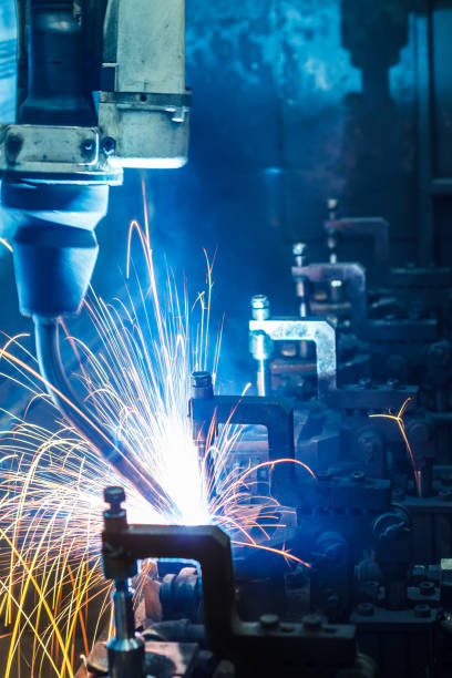 istock Robots welding in a car factory 1047965204