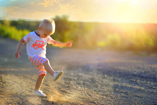 istock Little cute baby plays runs on summer nature 1047965430