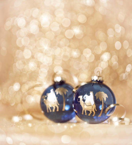 istock Christmas Wise Men Nativity Bauble on a Gold and Glittery Background 1047965474