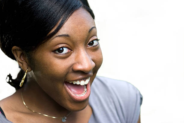 istock Happy young black woman on white background 104796582