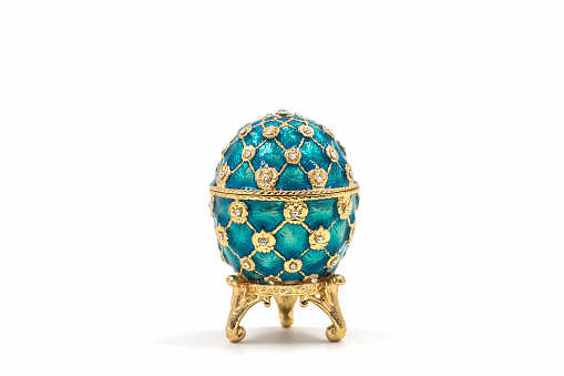 Faberge eggs on white background. Decorative ceramic easter egg for jewellery.