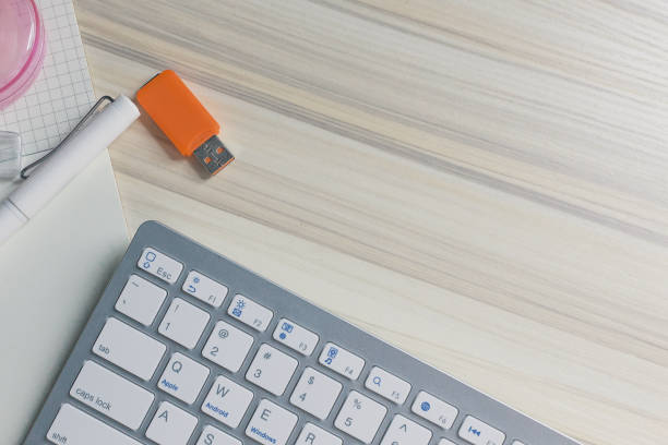 istock The work station office flat lay wood table image for background. 1047970314