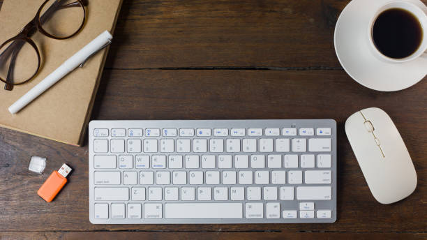 istock The work station office flat lay wood table image for background. 1047970492