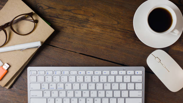 istock The work station office flat lay wood table image for background. 1047970602