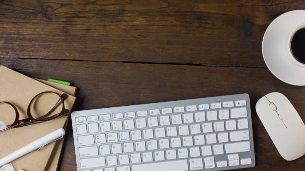 istock The work station office flat lay wood table image for background. 1047970644
