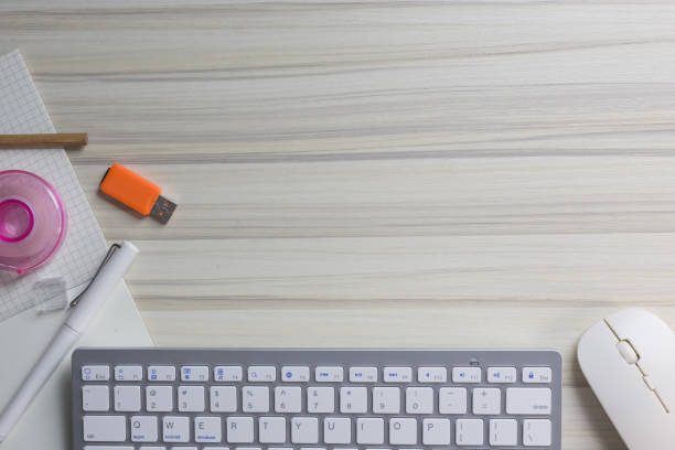 istock The work station office flat lay wood table image for background. 1047970886