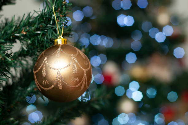 istock christmas decoration hanging on the tree - christmas ornaments 1047973224
