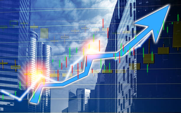 istock Composing with business building and stock chart on background (blue bull chart) 1047979822