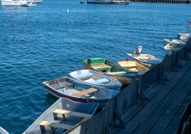 istock Small rowing boats tied to a dock area 1047980652