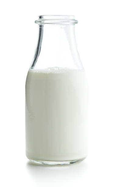 istock Opened bottle with milk isolated on white background. 1047984112