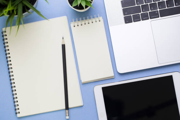 istock Top view of business office on black background with empty space for text information 1047985248