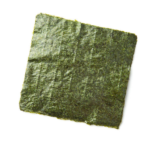 Green nori sheet Green nori sheet isolated on white background. Nori is the ingredient for sushi. nori edible seaweed sheet stock pictures, royalty-free photos & images
