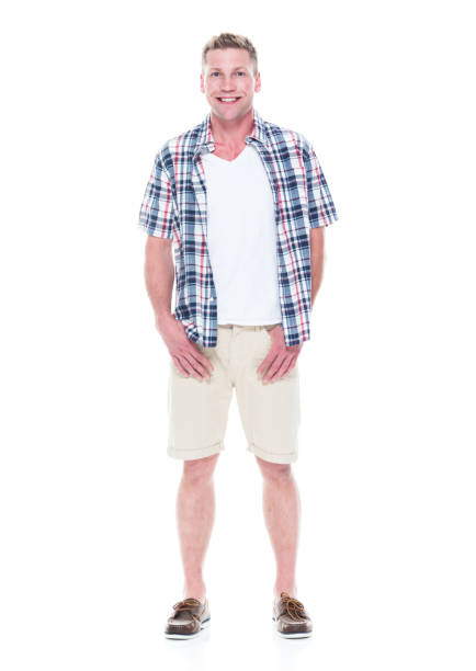 istock Handsome man in shirt and shorts 1047994136