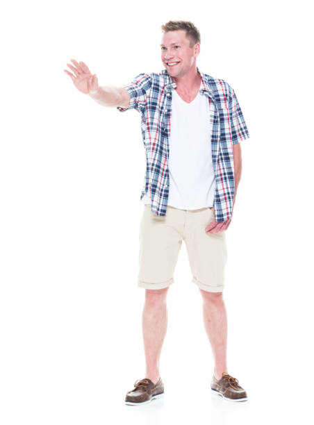 istock Handsome man in shirt and shorts holding a stop hand gesture 1047994514
