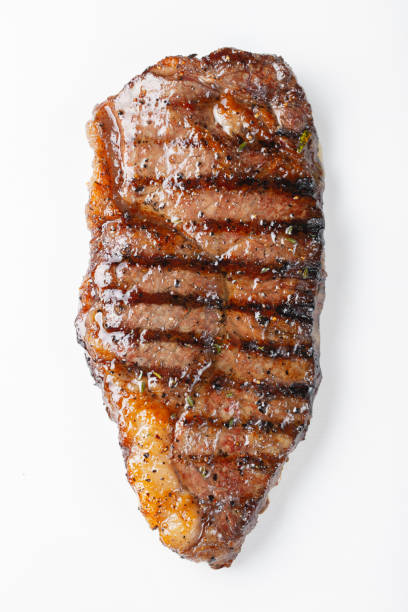 istock grilled marbled beef steak striploin isolated on white background, top view 1048000222