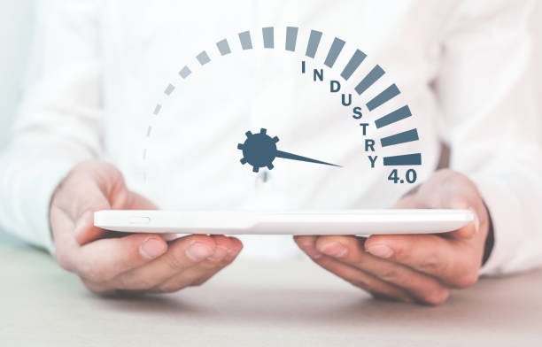 istock Man holding tablet with Industry 4.0 speedometer. 1048000522