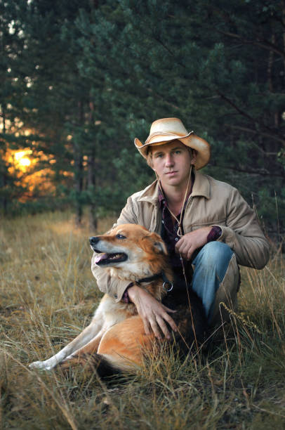 istock young cowboy man and his dog 1048001432