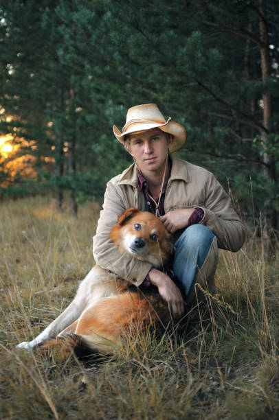istock young cowboy man and his dog 1048004022