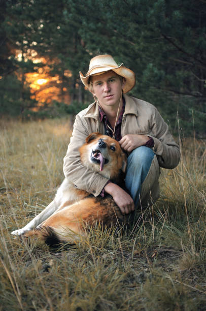 istock young cowboy man and his dog 1048004028
