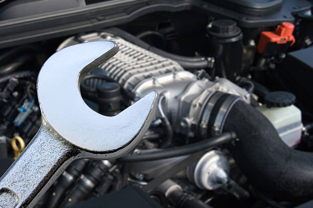 V8 Supercharged car engine and spanner stock photo
