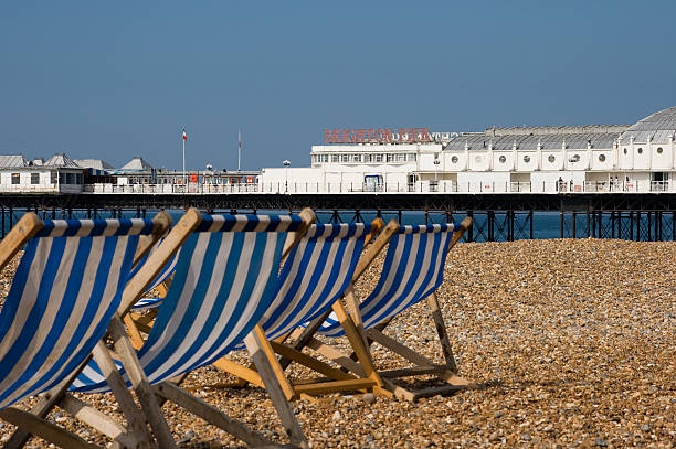 Deckchairs and Brighton Pier stock photo