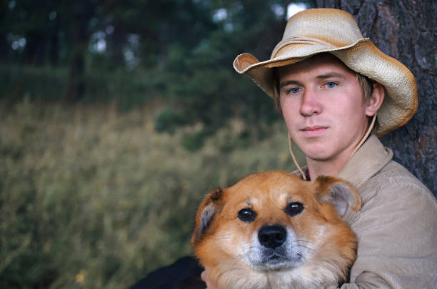 istock young cowboy man and his dog 1048014208
