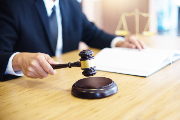 istock lawyer or  judge work in the office with gavel 1048018464