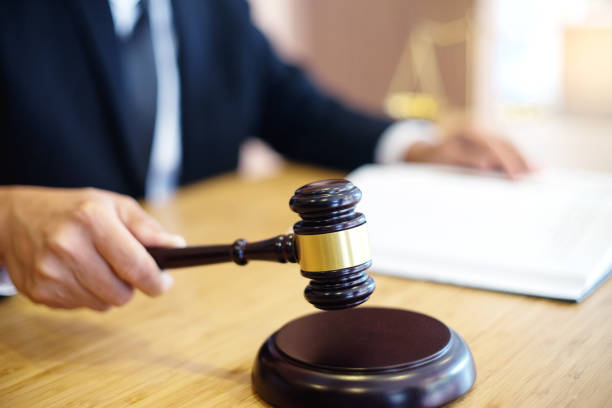 istock lawyer or  judge work in the office with gavel 1048018466