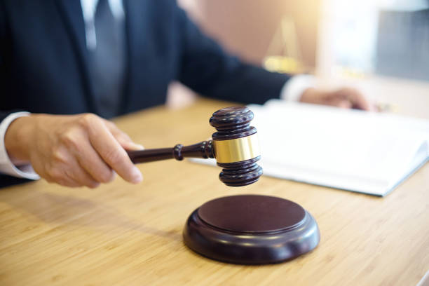 istock lawyer or  judge work in the office with gavel 1048018482
