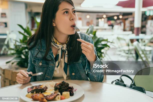 Beautiful Lady Sitting Outdoor And Having Lunch Stock Photo - Download Image Now - Chewing, Food, Women