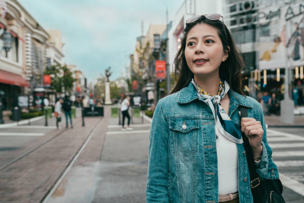istock beautiful lady standing on the road 1048028364