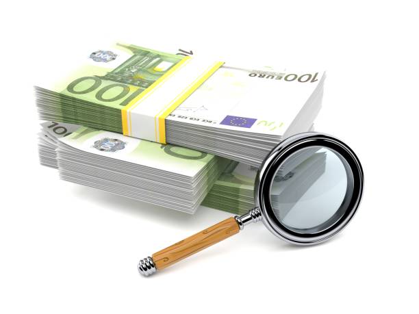 istock Euro currency with magnifying glass 1048031366
