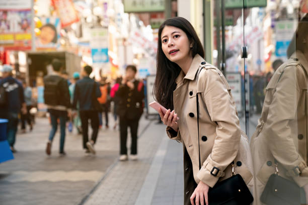 istock pretty girl rely on the show window 1048031522
