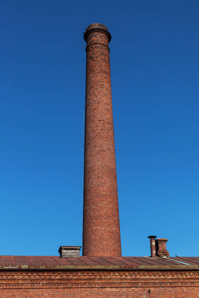 istock Chimney next to the water tower. 1048036764