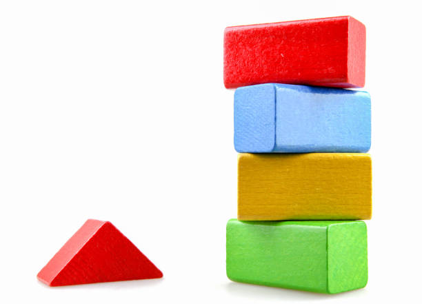 Wooden building blocks isolated on white background.