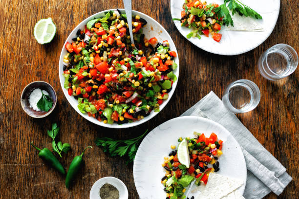istock Mexican taco salad plate dark wooden table 1048049892