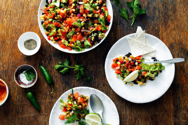 istock Mexican taco salad wooden table top view 1048050364