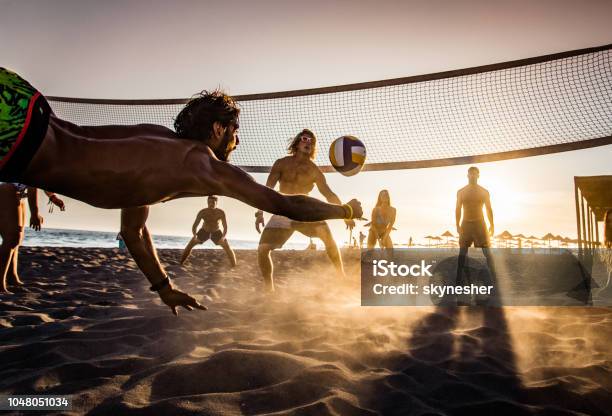 Beach Volleyball At Sunset Stock Photo - Download Image Now - Beach Volleyball, Beach, Summer