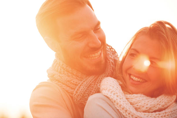 istock Smiling couple hugging outdoors at sunny day 1048051918